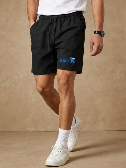 男士夏季新款时尚休闲刺绣字母轻薄短裤，适合日常通勤和度假穿着