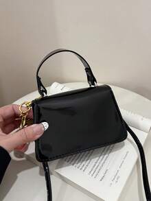 时尚纯色极简迷你手提包，女士斜挎包，适合购物、装钱包，适合年轻女士、大学生、上班族使用。是办公室、学校、工作、商务、通勤、户外活动、旅行和徒步的理想之选。 - 黑色 - 查看 5