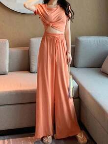 Juego de dos piezas para mujeres Conjunto de mujer: camiseta corta de manga corta ajustada y lisa que deja el ombligo al descubierto, pantalones holgados de cintura alta elástica y pantalones casuales - Naranja - Ver 3