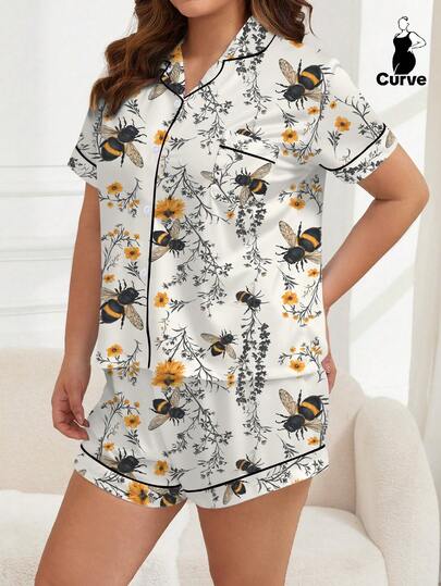 Bộ đồ ngủ 2 món màu trắng in hình ong và hoa dễ thương, gồm áo khoác ngắn tay thoải mái, áo sơ mi cổ bẻ và quần short cạp chun, kiểu dáng thời trang cho hoạt động ngoài trời, trong nhà và mọi mùa.