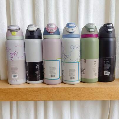 Owal-A 32盎司不锈钢保温水瓶 - 防漏运动水瓶，配备双功能吸嘴盖、翻盖吸管和宽口设计，可保温24小时，适合健身、旅行和日常使用。