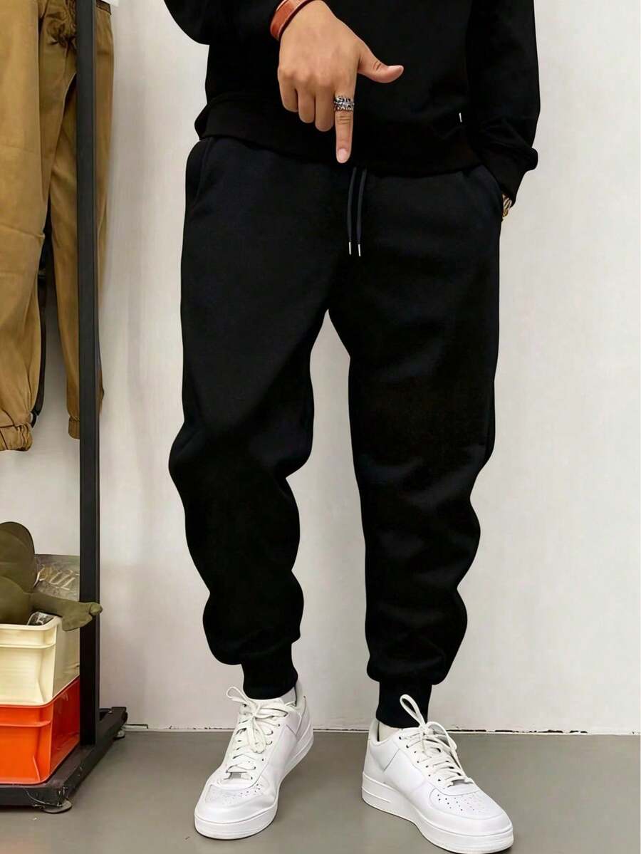 1 pieza Pantalones deportivos de unicolor con cordón para hombres, adecuados para correr al aire libre, entrenamiento en el gimnasio, pantalones de nueve minutos de una sola pierna, pantalones deportivos casuales de primavera y otoño para hombres - Negro - Ver 1