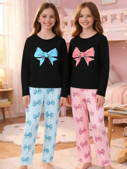 四件套女童睡衣套装，优雅时尚，休闲舒适。套装包含一件黑色长袖蝴蝶结装饰上衣、一条蝴蝶结印花长裤和一条蝴蝶结装饰睡裤，适合儿童和女孩在春、夏、秋、冬四季居家穿着。