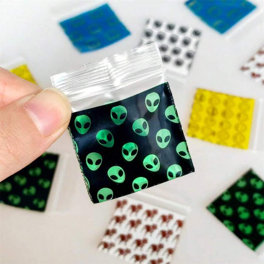 100个/包 新款可重复密封拉链袋，透明塑料袋，带图案设计，1.5英寸 x 1.5英寸小号烟草袋。户外必备烟草袋，多种款式可选
