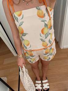 Bộ đồ nữ thanh lịch, thoải mái, thích hợp cho các chuyến đi chơi và du lịch, với họa tiết chanh mùa xuân/hè, in chìm, phối màu độc đáo và viền bèo nhún. - Nhiều màu - Xem 1