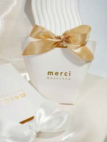 10个简约感谢礼盒，配缎带蝴蝶结，“Merci Beaucoup”金色字样纸质礼品盒，适用于婚礼、新娘送礼会、婴儿送礼会、派对回礼、糖果礼品和优雅活动包装。 - 6X6X10cm - 查看 4
