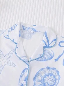 Bộ đồ ngủ trẻ em mùa hè kiểu dáng đại dương, chống cháy, gồm 2 món: áo khoác cardigan tay ngắn cổ bẻ và quần short cạp chun rộng rãi, nền trắng phối họa tiết đại dương xanh và vỏ sò, bộ đồ ngủ mặc nhà thoải mái, rộng rãi cho trẻ lớn. - trắng - Xem 3