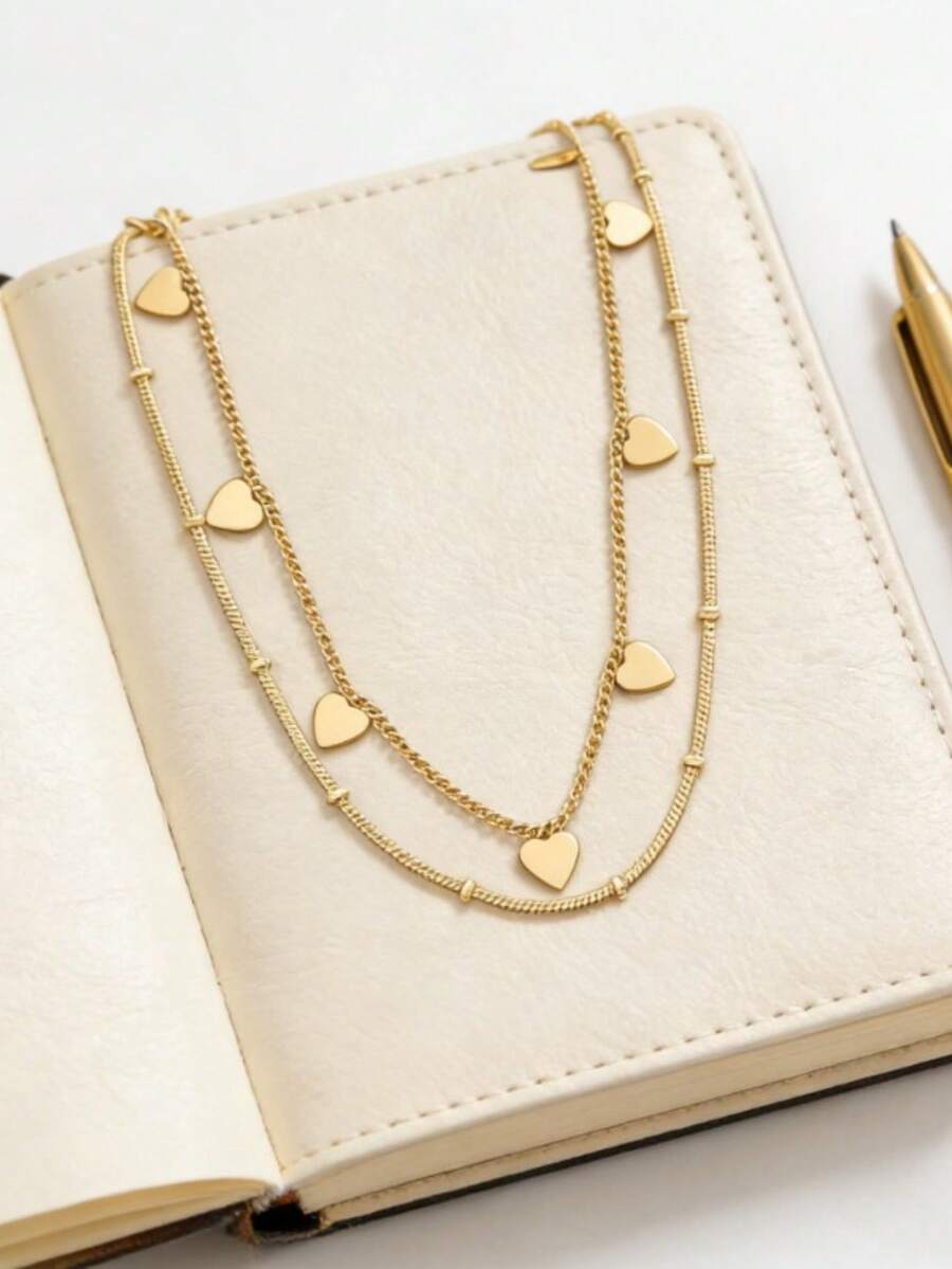1条复古简约亮面金属双层链项链，配有多个心形吊坠，适合女性日常佩戴、约会、情人节及作为礼物，采用OPP袋包装。 - 金色 - 查看 1