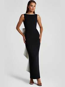 黑白撞色无袖收腰连衣裙，背部饰有仿珍珠蝴蝶结，修身时尚，适合春日晚宴、婚礼和派对穿着。 - 黑與白 - 查看 3