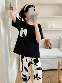 2pcs/Set Fashionable Girl's Casual Homewear, Including 1 Round Neck Black Short Sleeve Top And 1 Printed Straight Leg Pants, Suitable For Spring, Autumn And Summer Casual Wear - Black - View 1