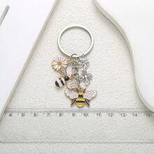 1个合金仿古银色蜜蜂花朵蝴蝶钥匙扣，可爱创意，适合送礼。 - 均碼 - 查看 6