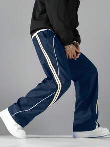 1 chiếc quần ống rộng dáng suông thời trang, có điểm nhấn là dải băng gân trang trí, thiết kế viền tương phản. Được làm từ vải polyester có độ bền tốt, chống mài mòn, nhẹ và không nhăn, phù hợp cho các hoạt động ngoài trời thư giãn và thể thao thoải mái. Cạp quần co giãn giúp mặc thoải mái hơn. Rất đáng để thử, thích hợp làm quà tặng. - Màu xanh hải quân - Xem 8