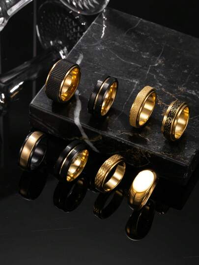 Set de 8 anillos de acero inoxidable en color negro y dorado, con elementos geométricos en negro mate y dorado, adecuados para uso diario, festivales y citas tanto para hombres como para mujeres