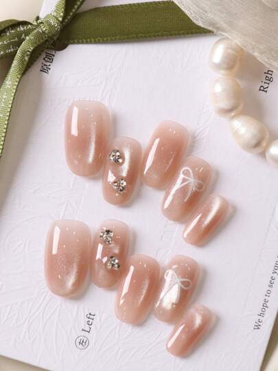 10片装按压式美甲贴片，短款美甲用品，粉色猫眼蝴蝶结假指甲，短款日常佩戴，适合办公室佩戴，人造指甲套装包含1张粘合贴片和1个迷你指甲锉。