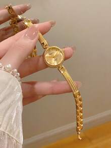 1 chiếc đồng hồ nữ thanh lịch, mặt số xanh lá cây, gọng bạc vàng, kiểu dáng tối giản, thường ngày. - Vàng - Xem 7