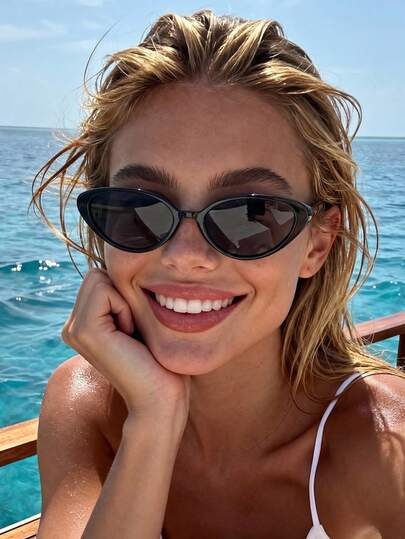 一副黑色猫眼小框太阳镜，时尚男女通用款，适合派对装扮、家庭出游、旅行、夏季海滩、户外活动