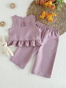 Bộ 2 món áo hai dây và quần màu tím cho bé gái, có nơ trang trí, thiết kế hở lưng, phù hợp cho các hoạt động hàng ngày. - Màu Lilac Tím - Xem 2
