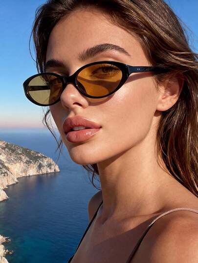 一副男女通用的棕色猫眼太阳镜，适合日常佩戴、夏季度假、街头派对、节日等场合，必备配饰