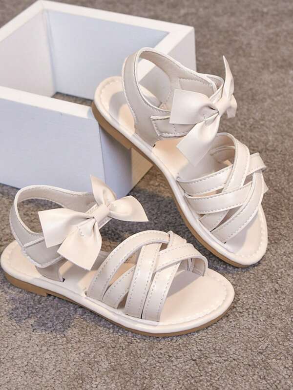 1 đôi dép xăng đan cho bé gái, có nơ trang trí, kiểu giày công chúa thời trang, dép xăng đan mùa hè cho trẻ em, hở mũi, đế mềm chống trượt.