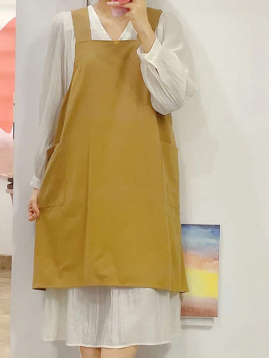 1 chiếc tạp dề unisex cỡ lớn màu vàng, nhẹ, kiểu dáng chéo lưng, có túi, chất liệu cotton tối giản hiện đại, dễ mặc vào/cởi ra, chống bám bẩn, phù hợp cho nhiều dịp. - màu vàng - Xem 1