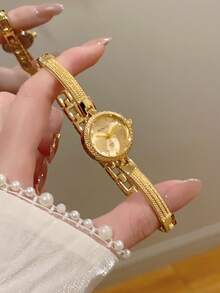 1 chiếc đồng hồ nữ thanh lịch, mặt số xanh lá cây, gọng bạc vàng, kiểu dáng tối giản, thường ngày. - Vàng - Xem 2