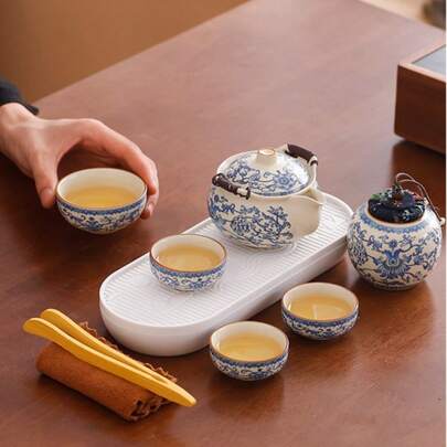 1 juego de té kung fu de cerámica azul y blanca portátil de estilo chino de 9 piezas con tetera de mano y patrón de loto entrelazado, estilo horno Ru que incluye 1 tetera, 4 tazas y 1 carrito de té, juego de regalo.