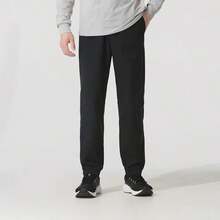 Under Armour Pantalones jogger tejidos Icon, pantalones de entrenamiento de ajuste holgado con cordón en la cintura, 6000663 - Negro - Ver 1