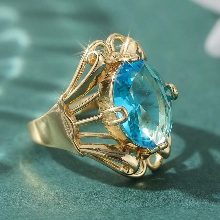 Anillo vintage con tono de cobre, incrustado con piedra de zirconia sintética azul ovalada - Dorado - Ver 1