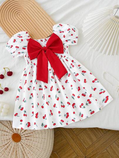 Đầm công chúa dáng chữ A phối họa tiết trái cây anh đào hoạt hình in hình nơ lớn, kiểu dáng thường ngày, thích hợp mặc ngoài trời, dành cho bé gái.