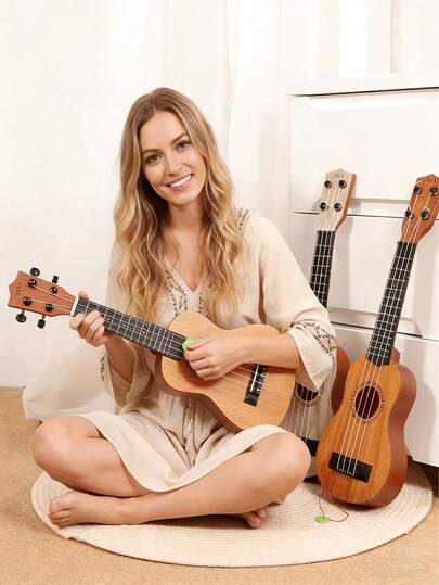 17英寸可弹奏尤克里里吉他，轻巧便携，尼龙琴弦手感舒适，附赠拨片，开放式调音旋钮，适合初学者和音乐爱好者，是热门的节日礼物。