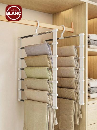 1 st multifunktionell bärbar förvaringsgalge - Mångsidig stegehängande byxorganisatör för effektiv platsbesparing, perfekt för klänningsbyxor, jeans, kjolar med mera - Klämmor i rostfritt stål för förvaring som inte lämnar märken - Perfekt för vår- och sommaruppfräschning av garderoben, omfamna minimalistisk stil, förbättra din garderobsorganisation inför kommande helgdagar som alla hjärtans dag, mors dag, nyår och alla hjärtans dag - Enkel montering för snabb installation och användning, maximera dina förvaringslösningar med detta viktiga garderobstillbehör!