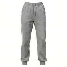 Estos pantalones deportivos de pierna recta están confeccionados en un tejido suave y ligero. Cuentan con una cinturilla elástica con cordón para un ajuste perfecto y bolsillos laterales, ideales para el día a día urbano o para looks informales. - gris - Ver 11