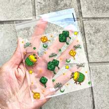 50/100个装绿色透明开斋节包装袋，印有星星、月亮和城堡图案，节日自粘袋，带有阿拉伯风格，四合一混合款 - 适用于斋月和开斋节礼品包装 - 彩色 - 查看 3