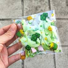 50/100个装绿色透明开斋节包装袋，印有星星、月亮和城堡图案，节日自粘袋，带有阿拉伯风格，四合一混合款 - 适用于斋月和开斋节礼品包装 - 彩色 - 查看 8