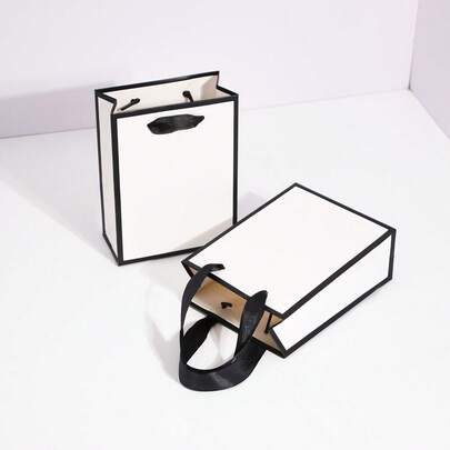 10个/20个装白色纸袋，黑色包边和提手，尺寸12x5.7x16厘米，优雅简约美学包装袋，适用于饰品、生日礼物、婚礼回礼、零售和公司活动。
