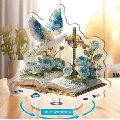 2D平面印刷旋转亚克力桌面摆件，单件装，展现一本打开的书，上方饰以蓝玫瑰和鸽子，为办公室增添宁静氛围，亦可作为庆典礼物。2D平面设计，办公装饰，庆典礼物，美观，优雅装饰，亚克力材质，高品质印刷，装饰品，桌面摆件，办公员工
