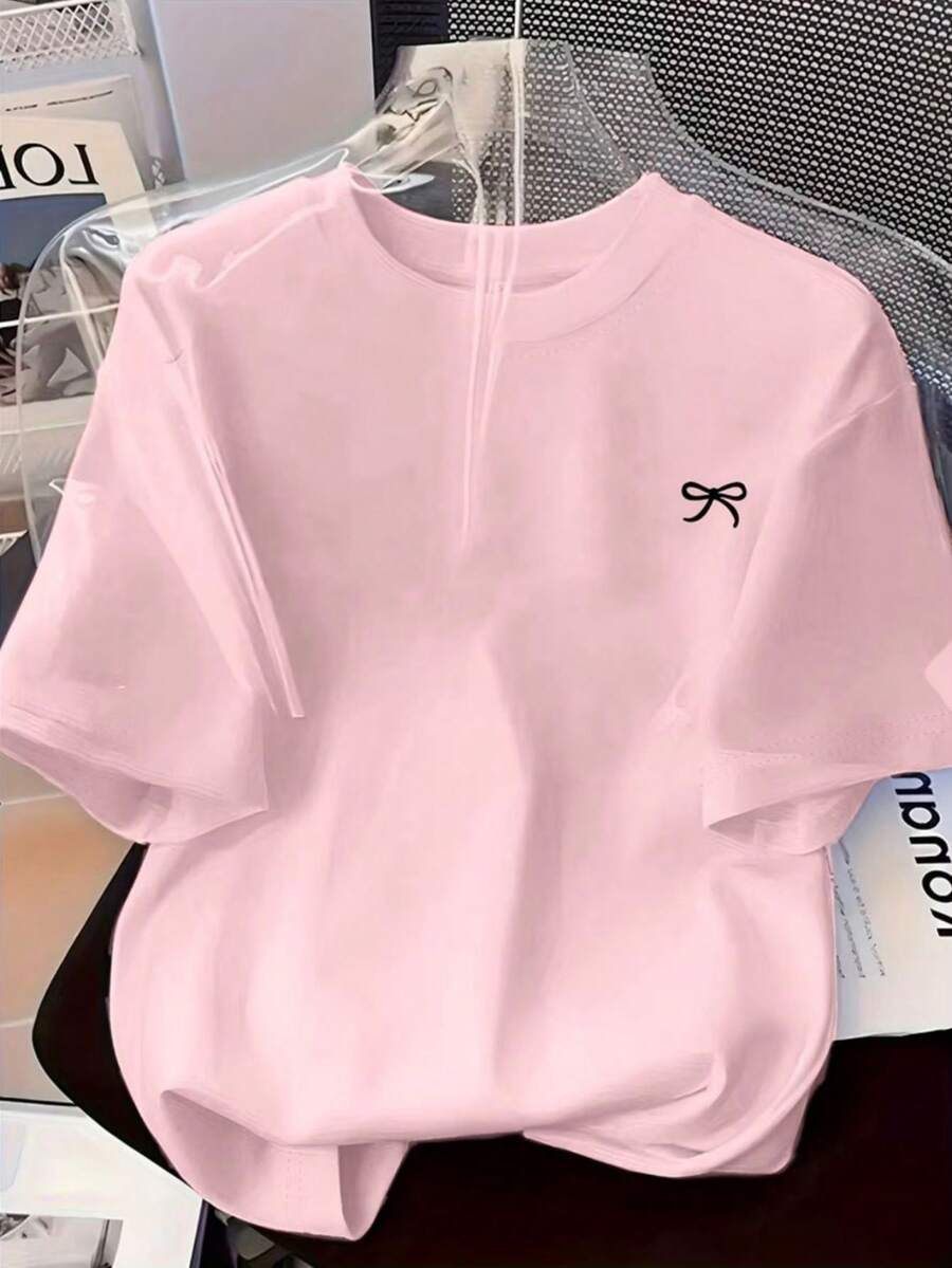 Women's T-Shirt With A Small Bow Print On The Chest, Cute And Delicate Casual Style, New Release Model, 100% Cotton, Exclusive For Spring/Summer. - Màu Hồng baby - Xem 1