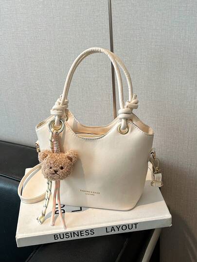 Nueva llegada Bolsa pequeña simple y popular, bolso de hombro y cruzado casual de gran capacidad con unicolor y lámina, bolso de cubo versátil y de moda con dije de oso