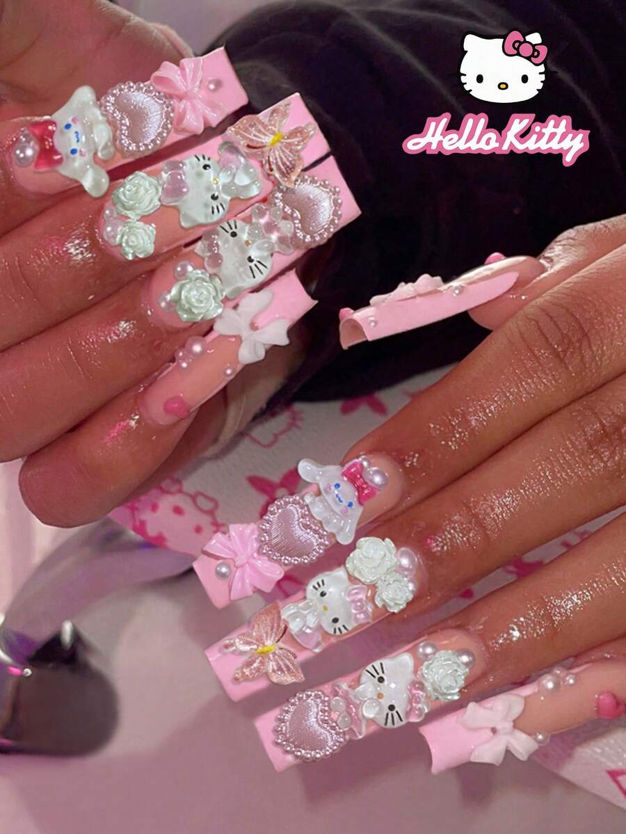 SANRIO 24片粉色法式长方形美甲贴纸，包含3D可爱装饰图案，如爱心、蝴蝶、花朵和珍珠，附赠1瓶胶水和1把指甲锉，适合女性日常生活和派对场合。 - 彩色 - 查看 1