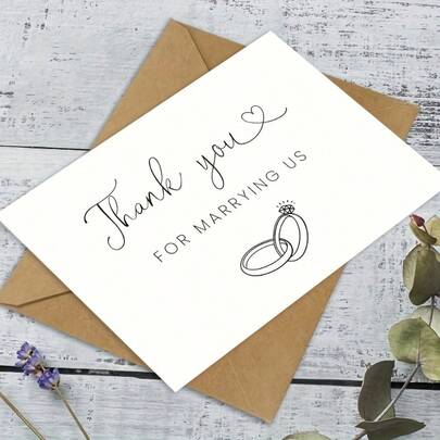 An Elegant Wedding Emcee Thank-You Card – With A Message Of "Thank You For Officiating Our Wedding," Featuring A Heart And Ring Design, Perfectly Expressing Gratitude To The Emcee.