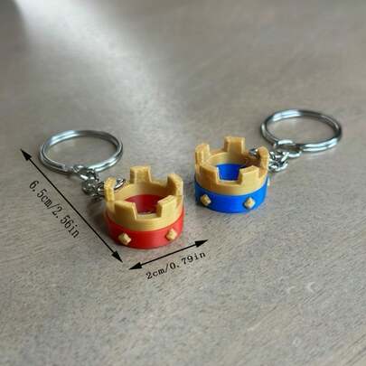 Crown Of The Assault Crown Keychain - 3D Printed Red And Blue Color Scheme, Sturdy Metal Key Ring, Unique Design, Perfect As A Birthday And Anniversary Gift, Eye-Catching Everyday Carry Accessory, Durable Key Fob For Men And Women, Bold Color Contrast To Elevate Bags, Backpacks, And Keys, Modern Statement Piece For Fashion Conscious Fans