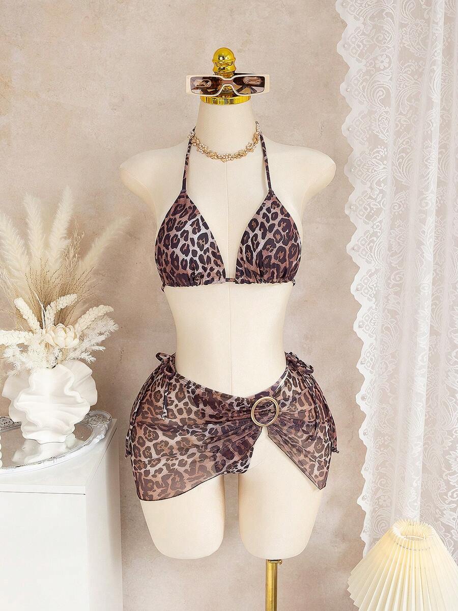 Bộ bikini nữ, đồ bơi 3 mảnh với họa tiết da báo, áo ngực tam giác, quần bơi buộc dây bên hông, váy ngắn lưới và điểm nhấn vòng kim loại, đồ đi biển mùa hè gợi cảm cho kỳ nghỉ. - Nhiều màu - Xem 1