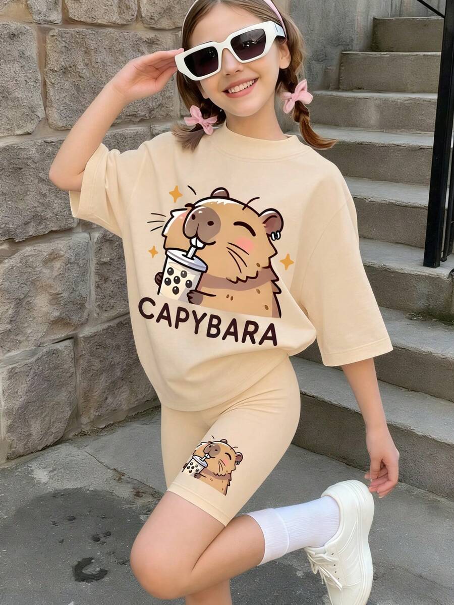 2pcs Girls Casual Outfit, Cute Capybara Drinking Bubble Tea Print Loose T-Shirt Paired With Capybara Bicycle Shorts Set, Suitable For School, Hangout, Daily Casual Wear, Summer - Apricot - View 1