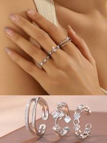 Conjunto de 3 anéis modernos e elegantes com zircônias cúbicas brilhantes em formato de coração, flor e design geométrico trançado. Design inovador, leve e luxuoso, com anéis ajustáveis. Acessórios femininos para o dia a dia, encontros e festas. - Prata - Ver 10