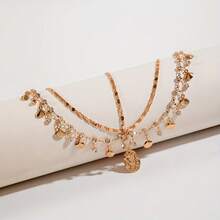 Một chiếc mũ đội đầu hình vỏ sò kiểu Bohemian sành điệu với kim loại, tua rua đính đá và mặt dây chuyền hình tròn không đều. Hoàn hảo cho các cô gái dự dạ hội, đám cưới, tiệc tùng, tụ họp và làm quà tặng cho bạn bè trong dịp Eid Al-Fitr. Phụ kiện tóc tua rua nhiều lớp đính đá lấp lánh kiểu Âu và Mỹ dành cho các cô gái, dây chuyền hình vỏ sò hình học. - Nhiều màu - Xem 9