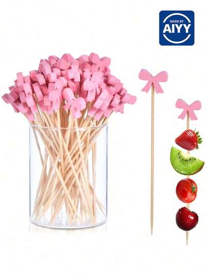 50/100 que xiên cocktail nơ hồng, làm thủ công, thích hợp dùng cho trái cây, bánh ngọt, bánh mì, món khai vị, v.v. Que xiên gỗ nơ hồng thủ công, thích hợp cho đám cưới, tiệc tùng, dã ngoại, tiệc nướng ngoài trời, tiệc Valentine, trang trí nhà cửa, quà tặng gia đình.