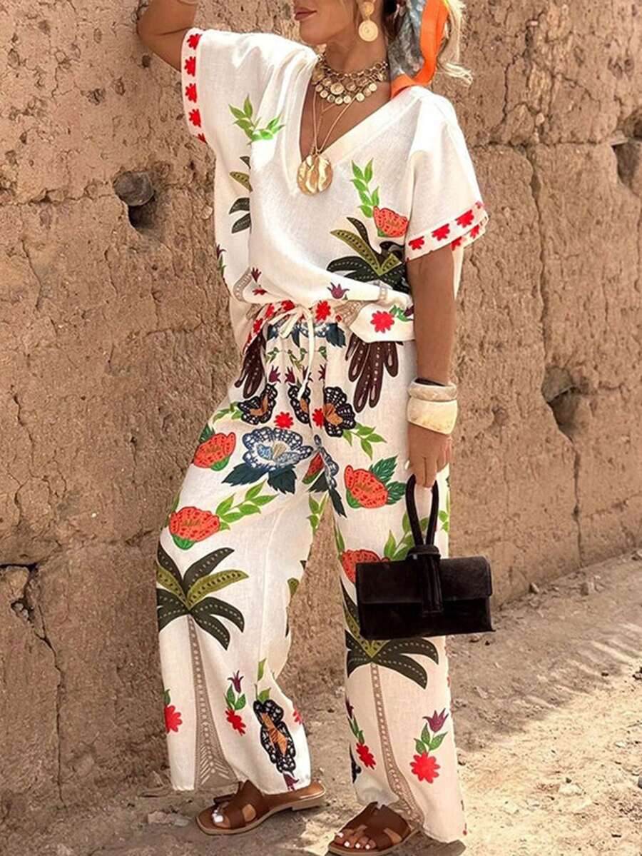 Magic Mia Women's Tropical Floral Print Two-Piece Set - V Neck Batwing Sleeve Top & High Waist Wide Leg Pants | Casual Loose Fit For Beach Vacations, Resort Getaways, Summer Brunch, Coastal Walks, Music Festivals & Boho Market Trips (Vibrant Palm & Flower Print & Drawstring Waist) For Effortless Vacation & Everyday Styling - 白色 - 查看 1