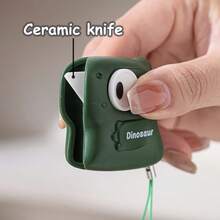 1 pieza Abridor de caja magnético de cerámica con diseño de dinosaurio lindo y práctico, cortador de caja, abridor de caja de cartón, cuchillo utilitario portátil - Dinosaurio - Ver 5