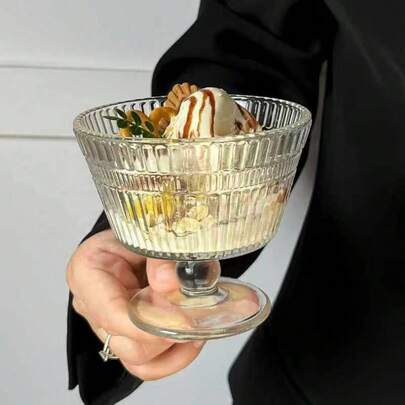 Classic European-Style Dessert Cup. This Stemware Features A Vertical Ribbed Structure In Transparent Glass, With Each Crisp Edge Reflecting A Delicate Luster. The Elegant Funnel-Shaped Body Is Paired With A Rounded Ball Stem And Wide Base, Providing Stability And A Sculptural Feel. The 255ml Capacity Is Perfect For A Serving Of Yogurt, Ice Cream Or Fruit Pudding, And The 10.4cm Diameter Allows For Layered Ingredients. Standing 9cm Tall, This Versatile Cup Is Suitable For Both Daily Use And Formal Occasions.