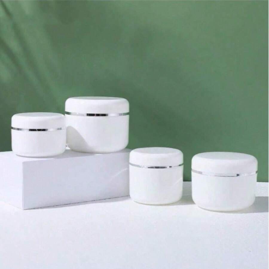 20/10/5个可重复灌装乳霜罐,容量分别为20克/30克/50克/100克,白色塑料材质,带圆顶盖,适用于存放乳霜、润唇膏、乳液等,是旅行和化妆品收纳的理想之选。 - 彩色 - 查看 1